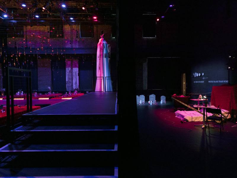 Looking backstage at Performance Space, black stairs lead up